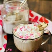 Drinking chocolate mix and a cup of drinking chocolate.