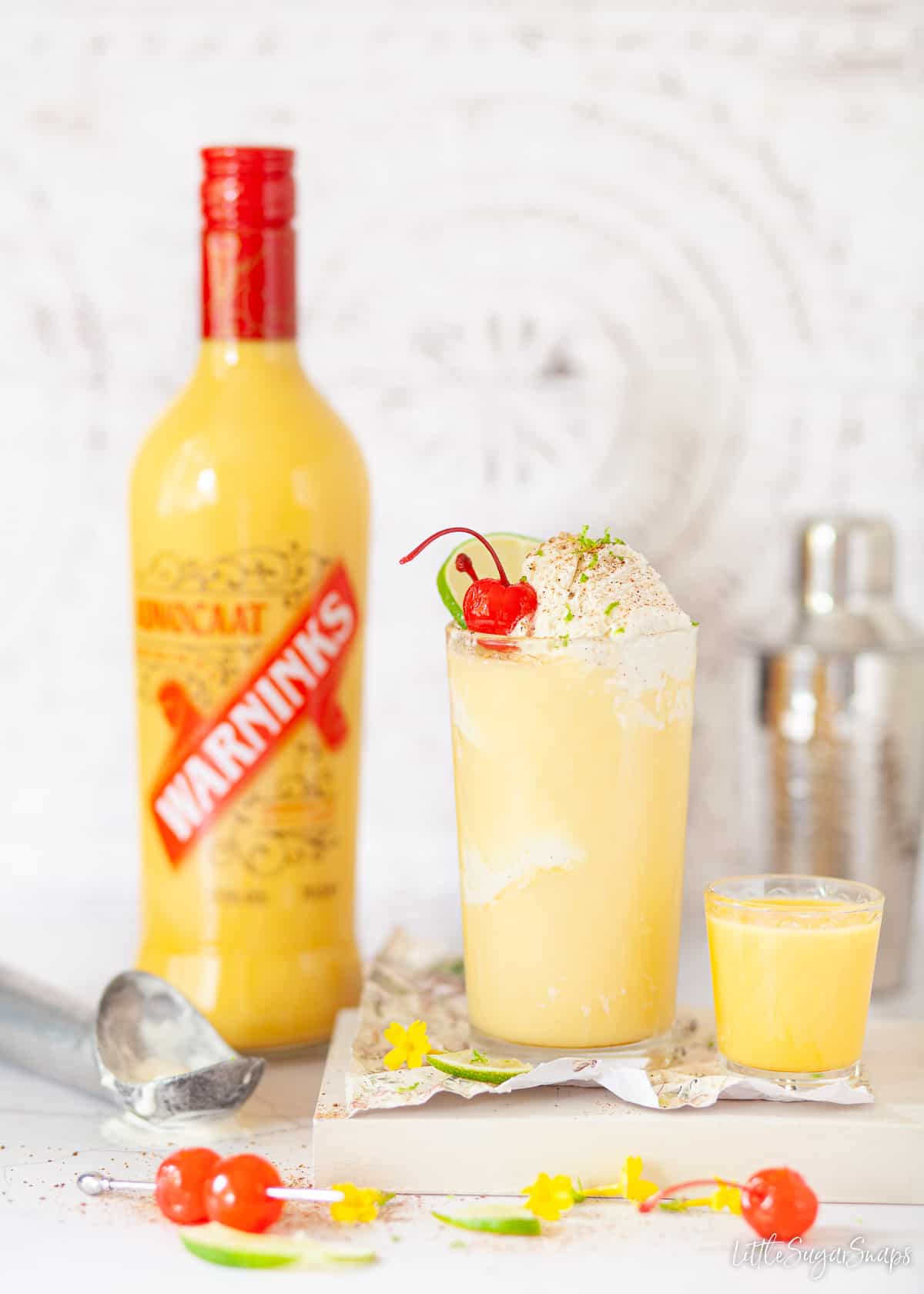A bottle of advocaat and a snowball with ice cream.