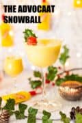 Snowball cocktail with holly garnish and text overlay