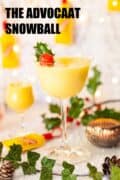 Snowball cocktail with holly garnish and text overlay