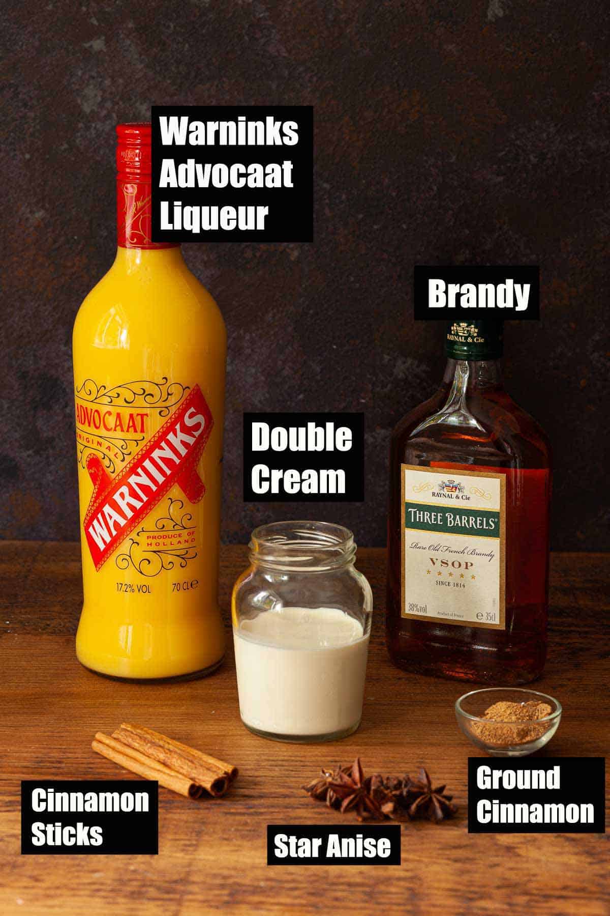 Ingredients for a warm advocaat cocktail with text overlay.