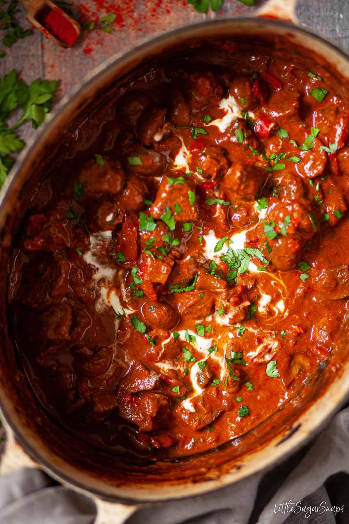 Slow cooked goulash in a Dutch oven.