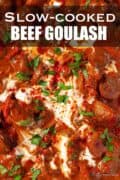 Close up of beef goulash with text overlay.