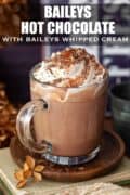 Cream topped Hot Chocolate with Baileys with a bottle of Irish Cream and text overlay..