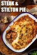 Steak and stilton pie in an enamel dish with text overlay.