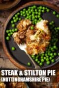 Steak and stilton cheese pie served with peas with text overlay.