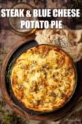 A potato topped pie with text overlay.