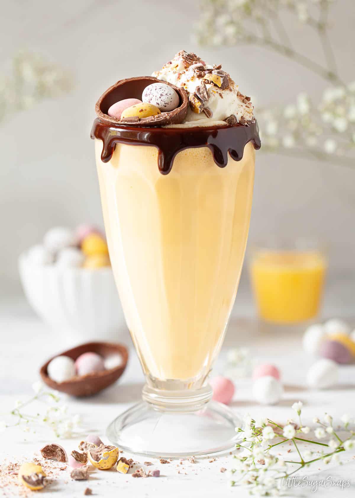 An alcoholic milkshake made with Warninks advocaat & topped with cream and Easter mini eggs.