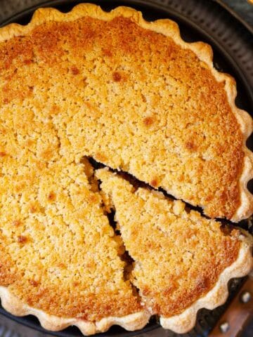 Close up photo of Buxton pudding with a slice cut.