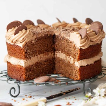 A cut into Cadbury's Drinking Chocolate Cake with Dairy Milk buttercream.