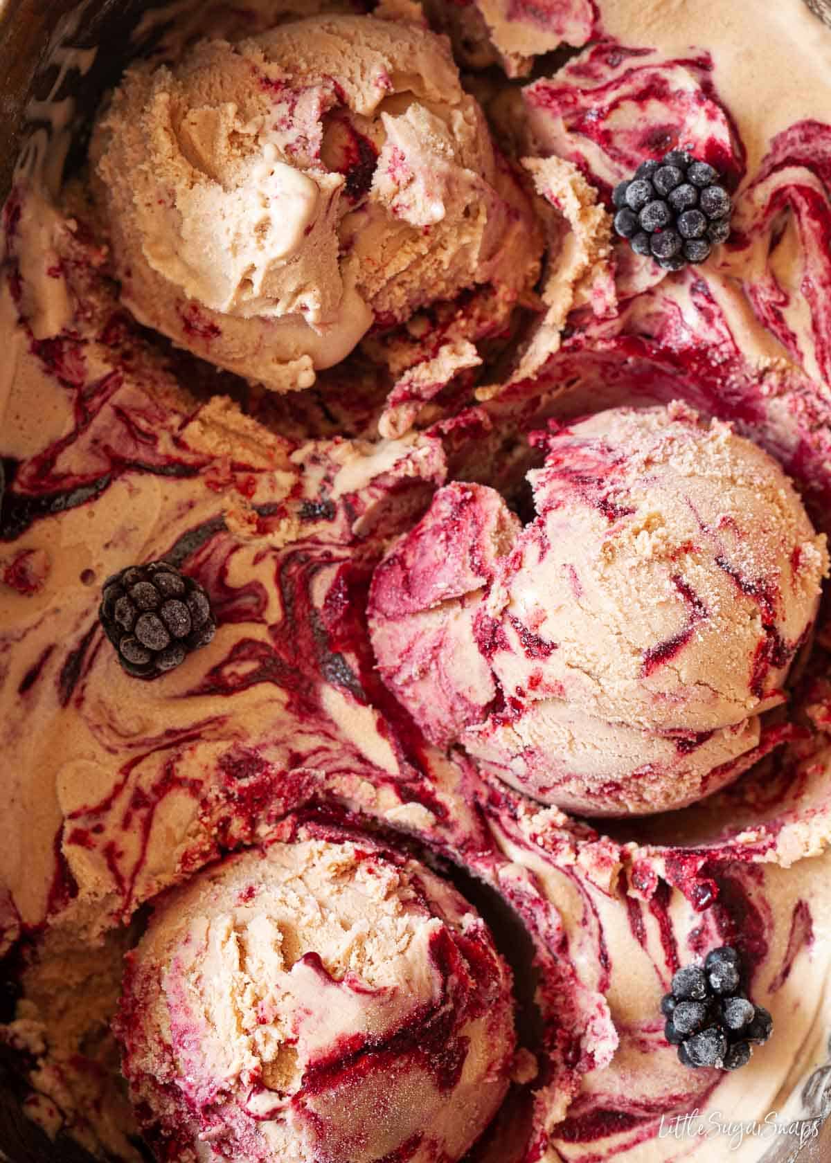 Close-up of chocolate ice cream with Nutella and blackberry ripple.