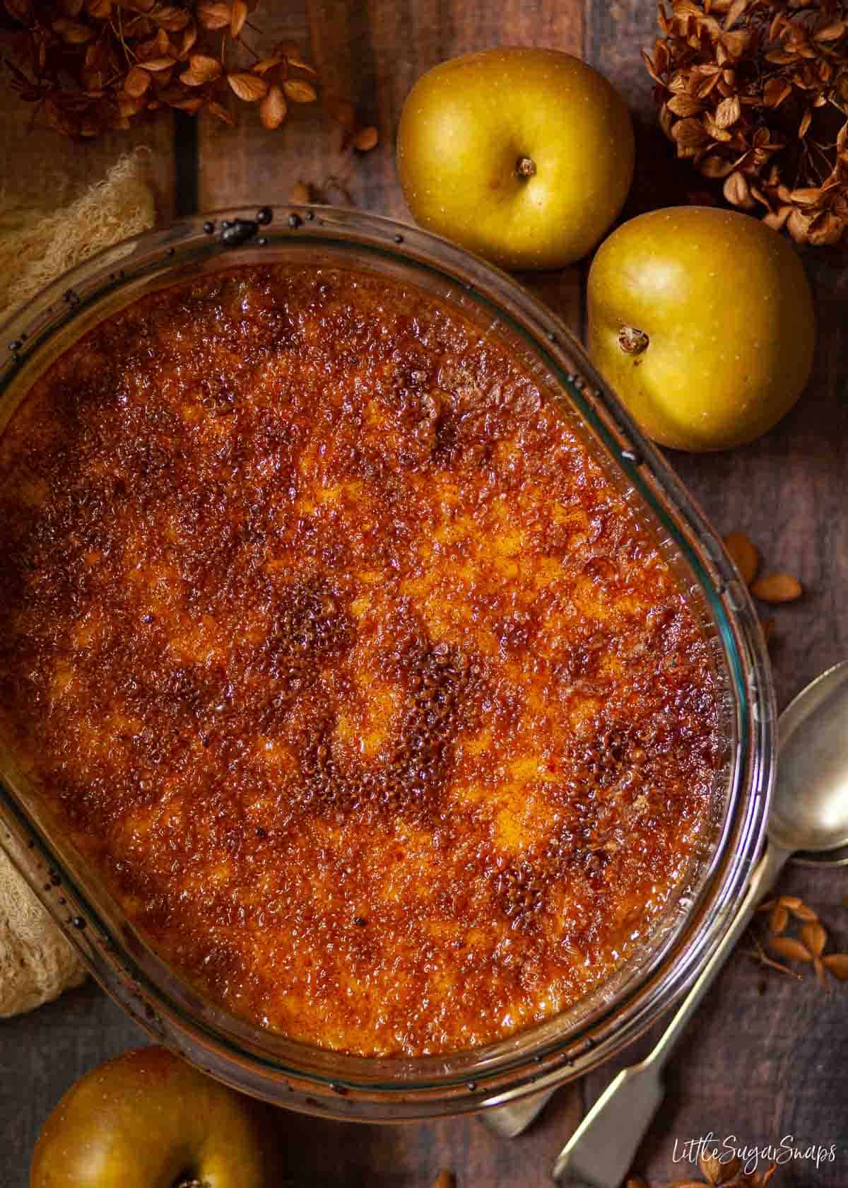 A whole Malvern pudding with a caramelised sugar topping in an oval dish.