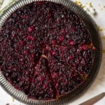 Close up of a blackcurrant upside down dessert cake.