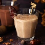 Two healthy date shake milkshakes. One is flavoured with spices and the other with chocolate