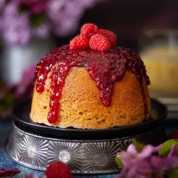 Steamed Jam and Sponge Pudding topped with fresh raspberries.