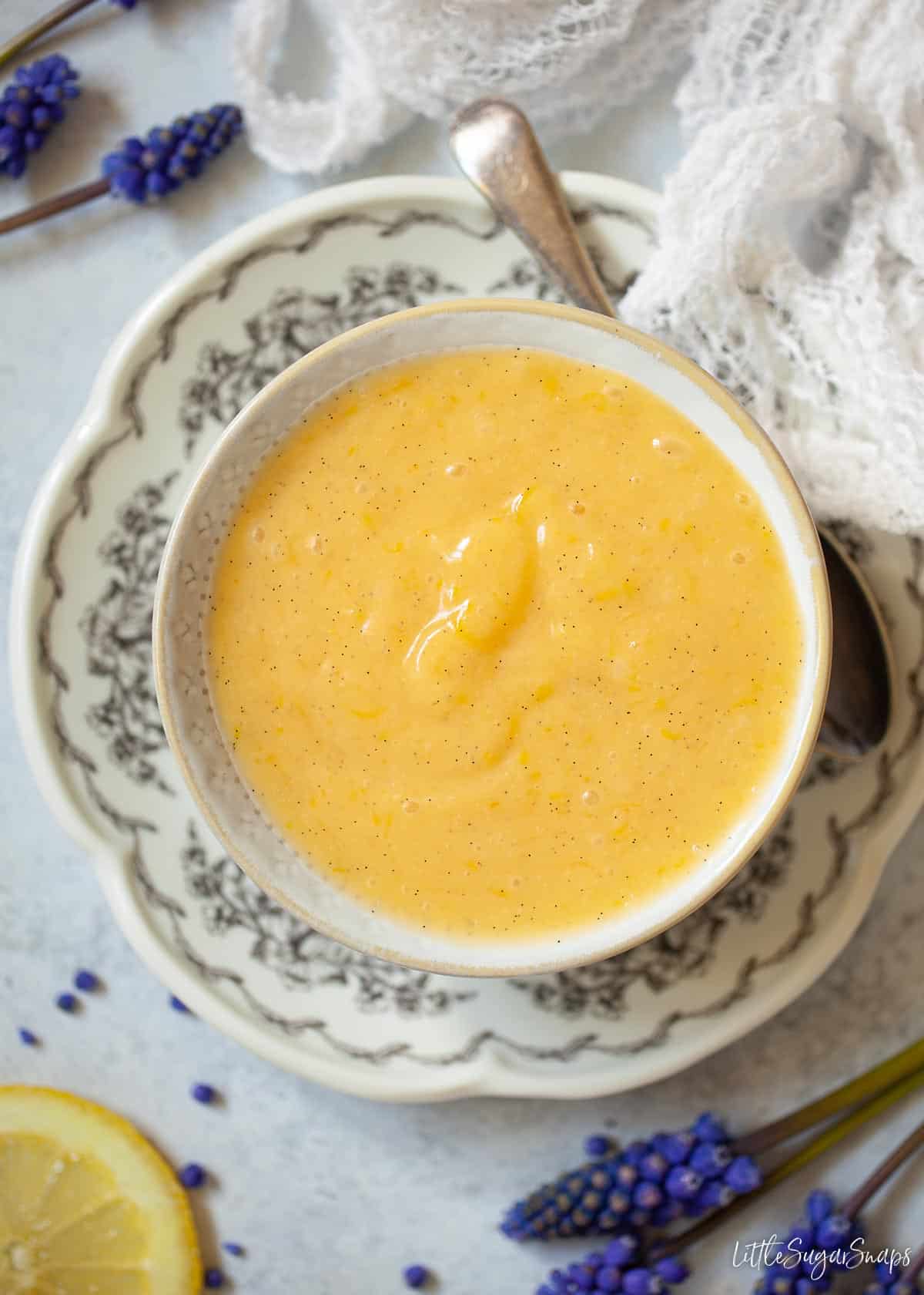 A bowl of vegetarian lemon curd flavoured with vanilla seeds.