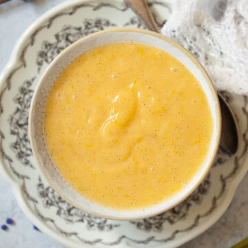 Overhead view of a pot of lemon cheese spread.