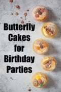 Butterfly cakes on a grey backdrop with text overlay.