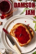 Toast spread with damson jam with text overlay.