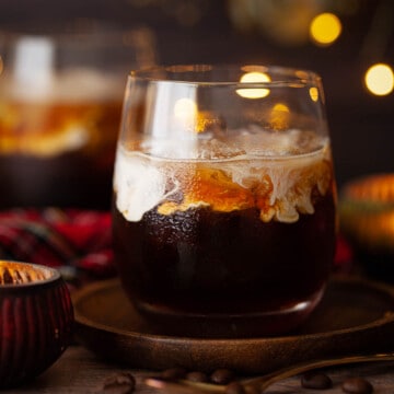 Close-up of a cocktail made with Drambuie, coffee and whisky, featuring a float of cream.