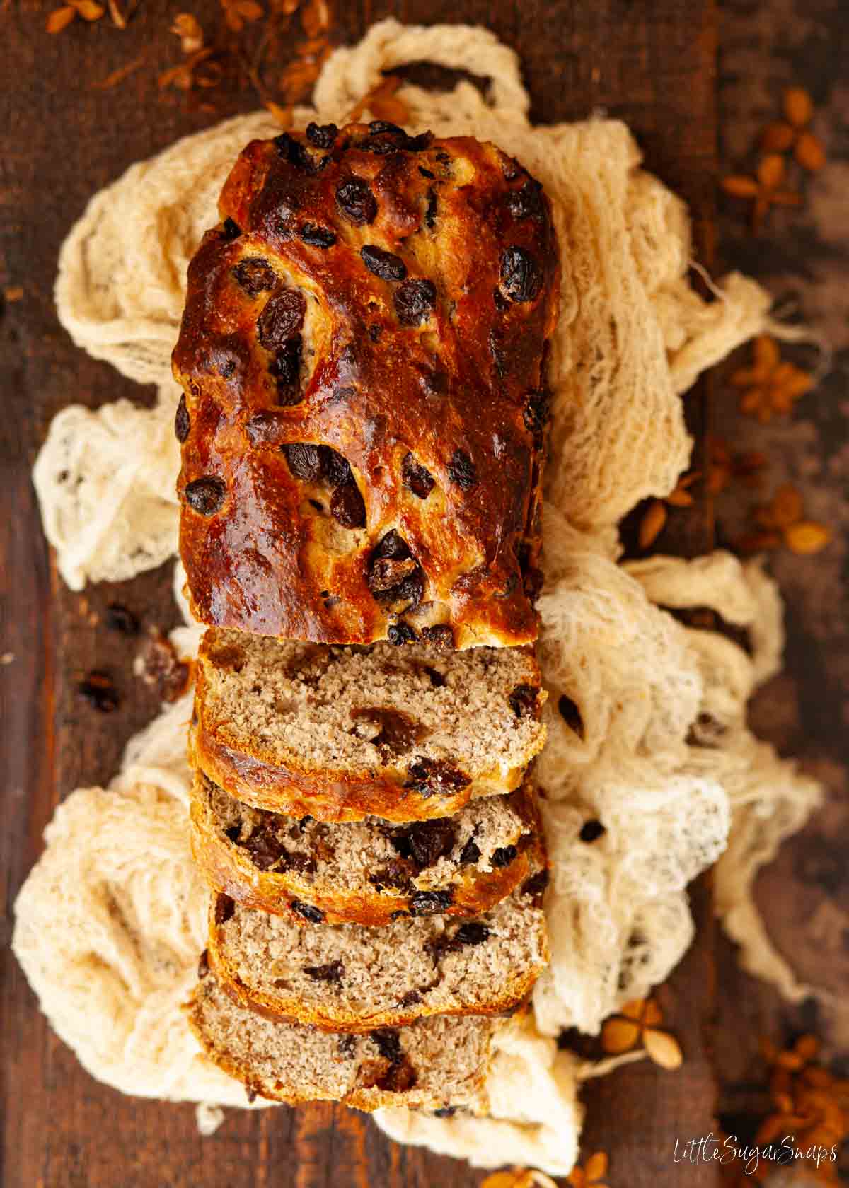 A Lincolnshire plum loaf partially sliced.