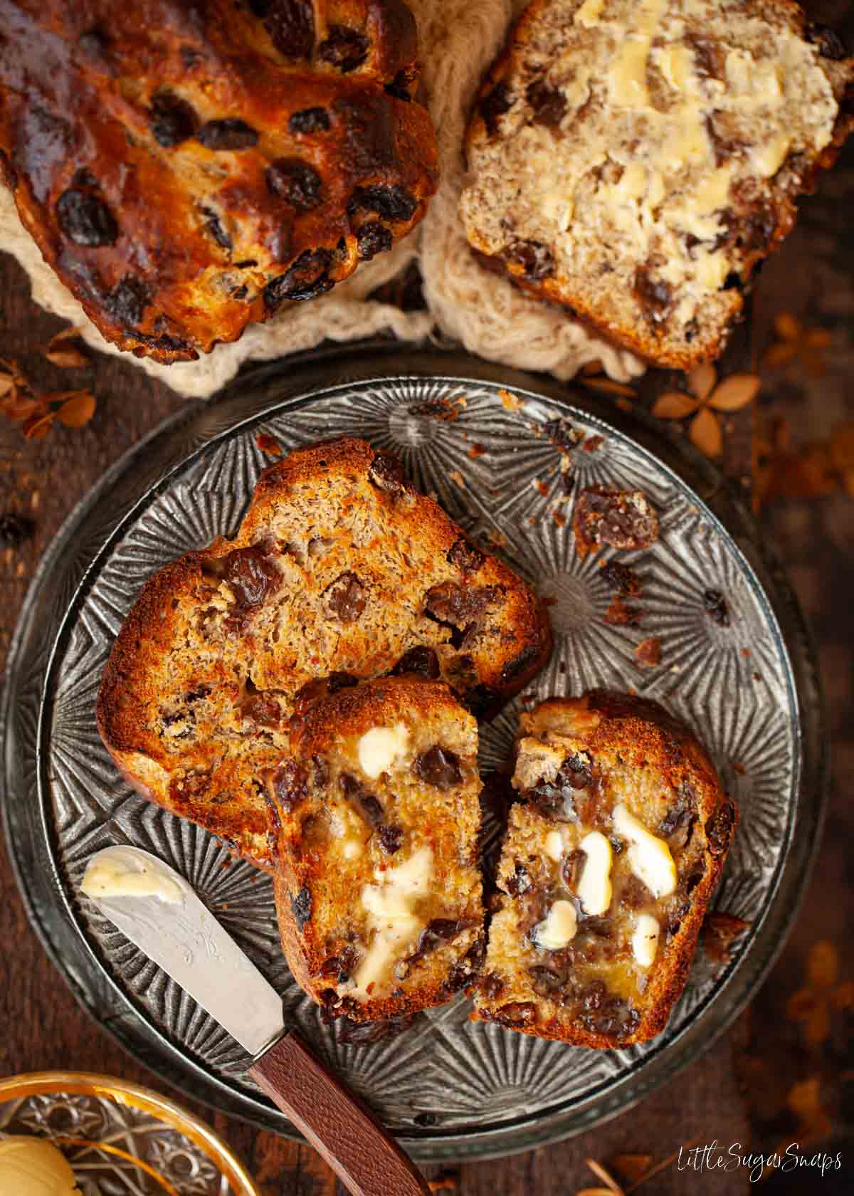 Slices of Lincolnshire plum bread toasted and spread with butter.