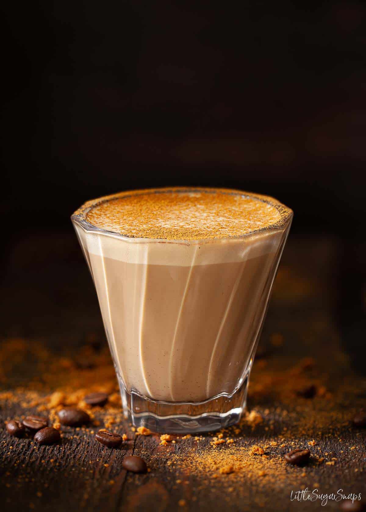 Cookie Butter latte in a coffee glass.