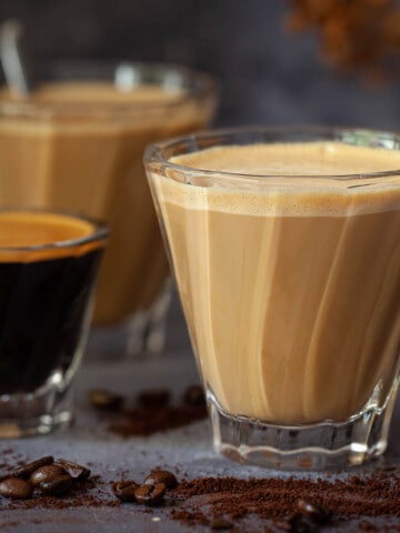 Close up of Spanish latte drinks and an espresso shot.