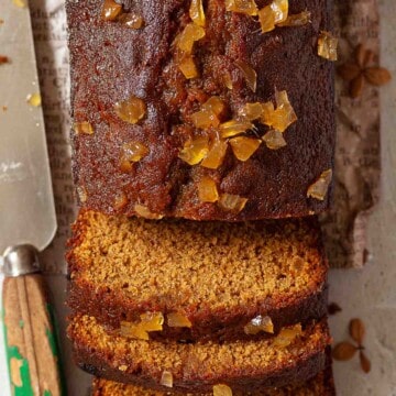 Close up view of a sticky ginger loaf cake.