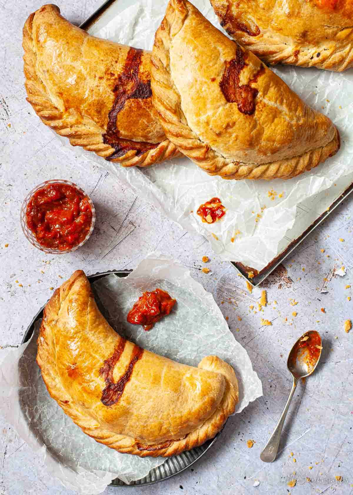 Vegetarian potato and cheese pasties served with tomato relish.