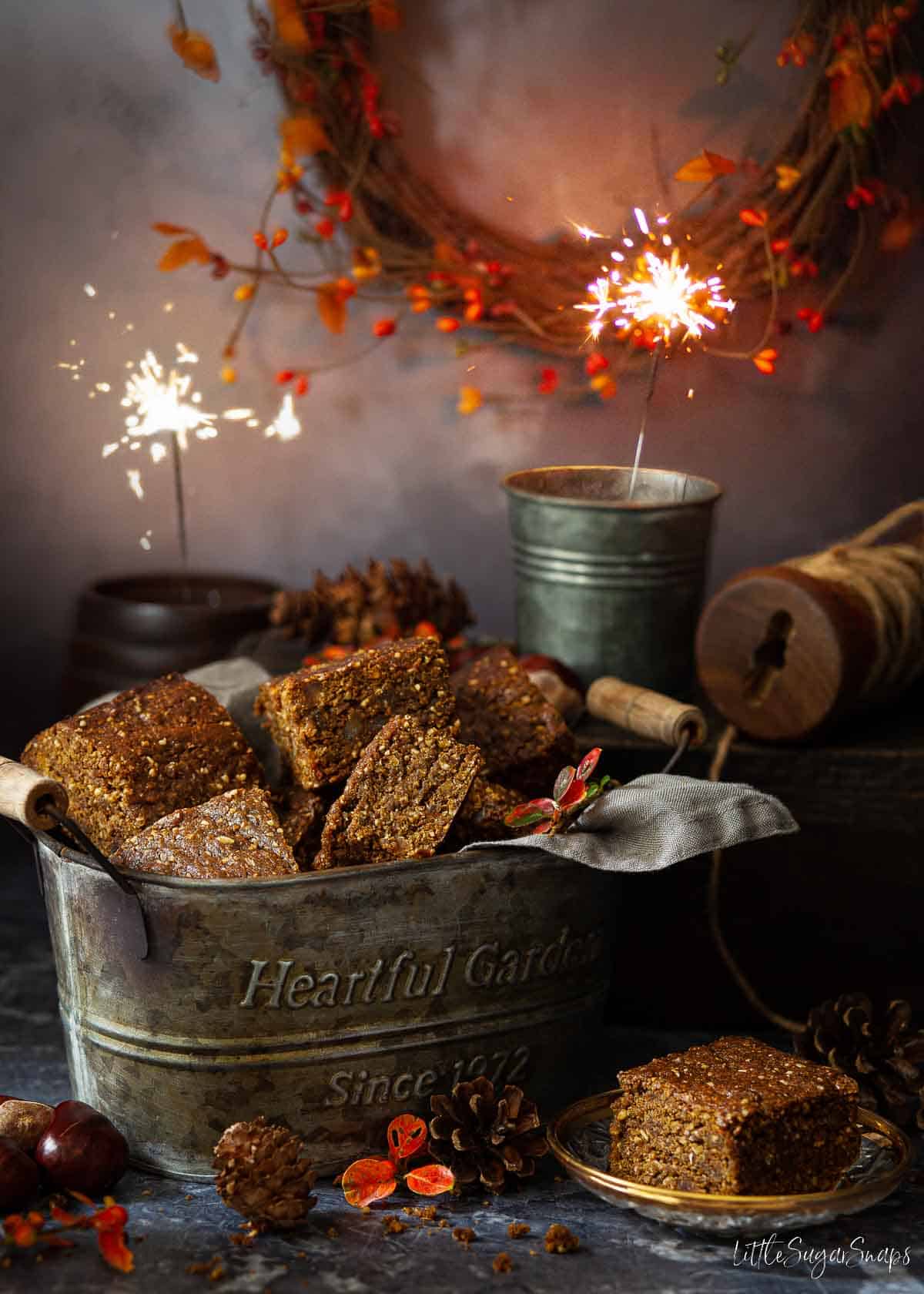 Black treacle thor cake for bonfire night with lit sparklers.