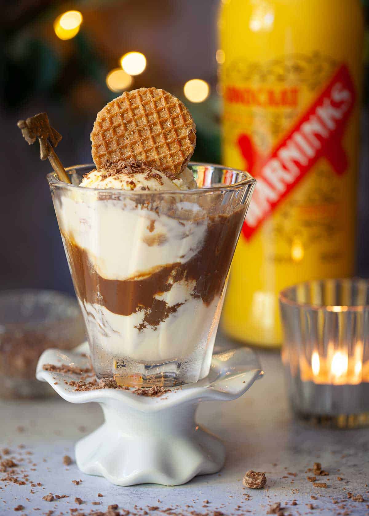 A glass of affagato al caffè (espresso and ice cream) with a cookie garnish.