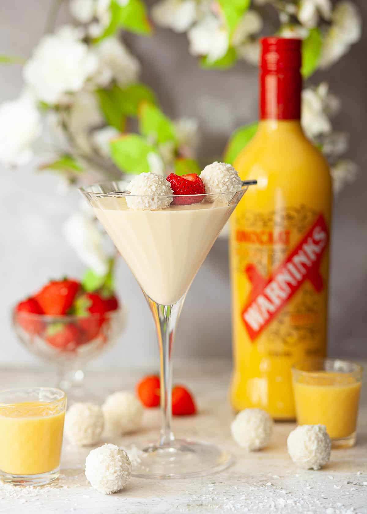 A creamy rum fluffy duck cocktail with chocolate abd strawberry garnish.