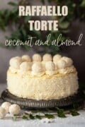 Labelled Raffaello torte decorated with desiccated coconut and white chocolates.