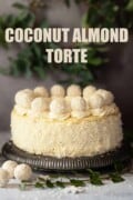 Labelled coconut and almond torte decorated with Ferrero Raffaello chocolates.