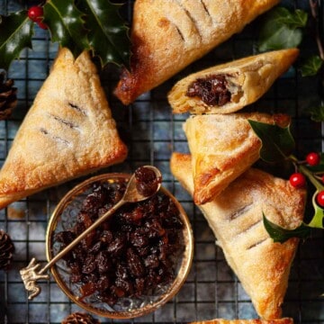 Square image of puff pastry and mincemeat turnovers.