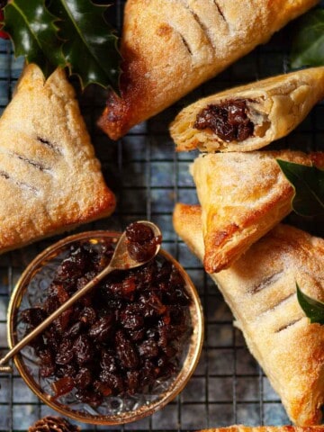 Square image of puff pastry and mincemeat turnovers.