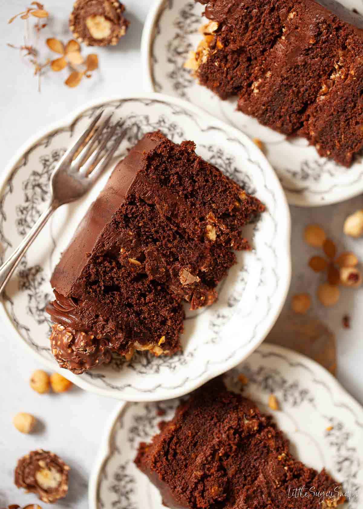 Slices of Ferrero Rocher Cake on plates.