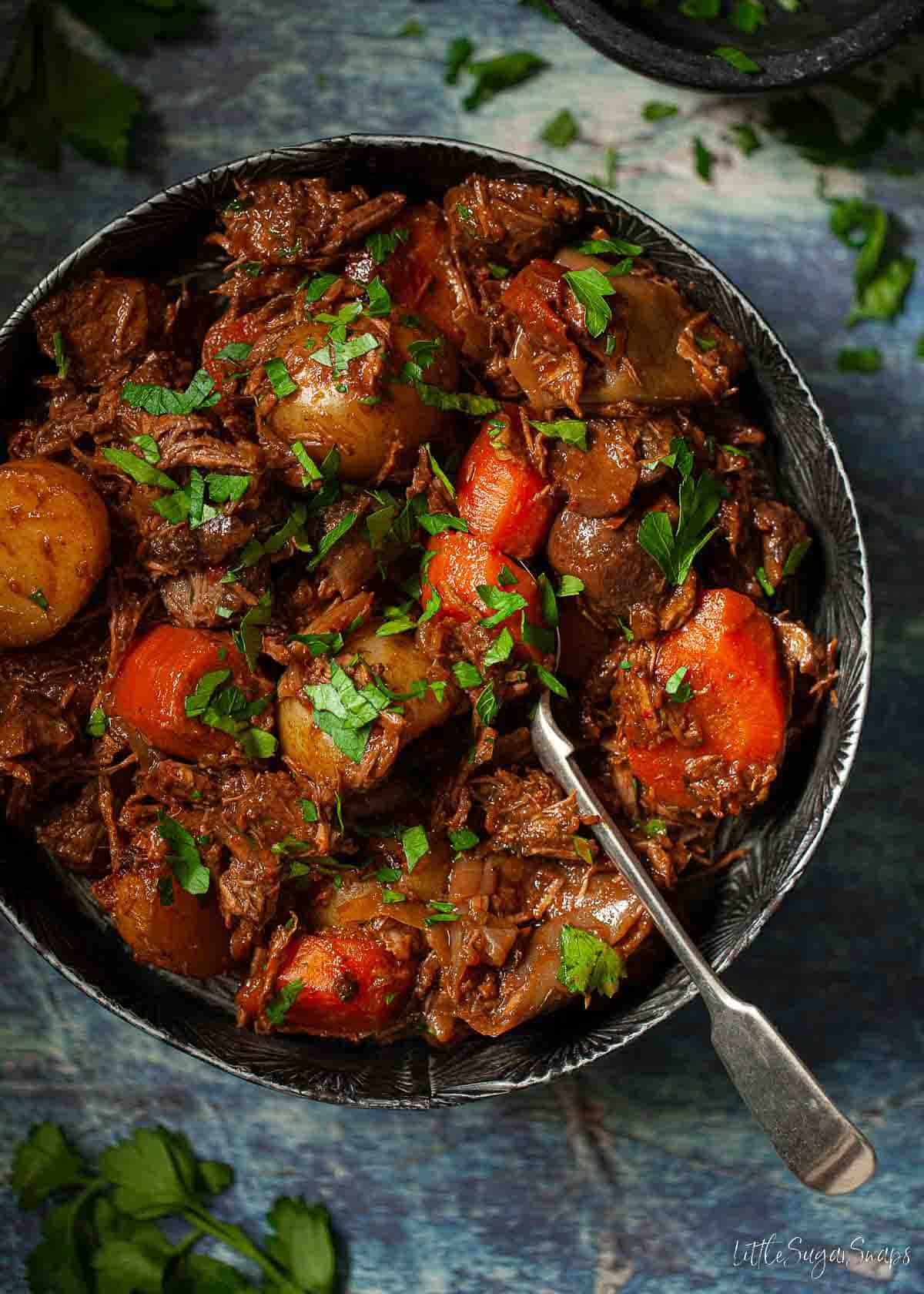 A bowl of Warwickshire stew with braised beef and vegetables.