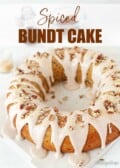 Labelled image of a spiced bundt cake with cinnamon water icing drizzled on top.