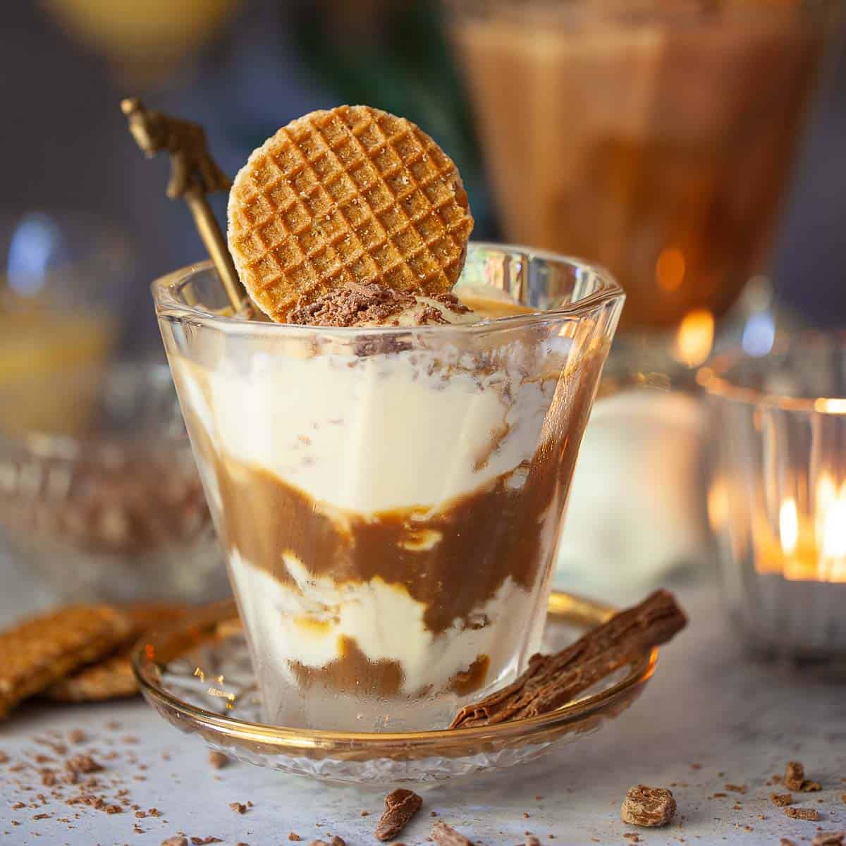 Advocaat affogato in a glass topped with mini stroopwafel.