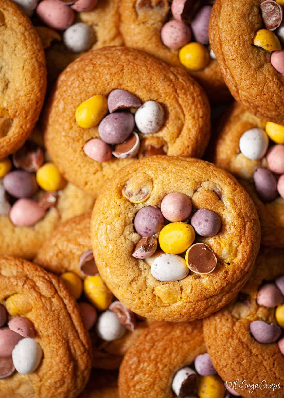 Close up of lots of Cadbury Mini Egg cookies.