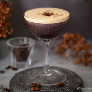 Close up of an espresso martini with rum topped with grated chocolate and coffee beans.