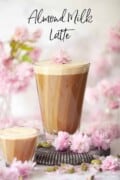 Labelled image of a tall glass of cardamom latte with almond milk.