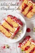 Three slices of raspberry layer cake on plates with a label.