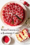A labelled raspberry layer cake with a slice lying on a plate next to it.