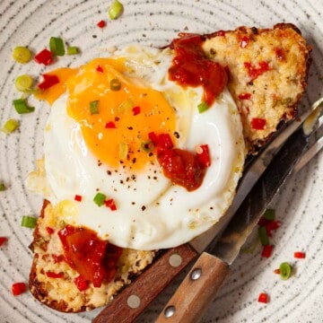 Chilli cheese toast topped with diced chilli, onion, fried egg and chilli chutney.