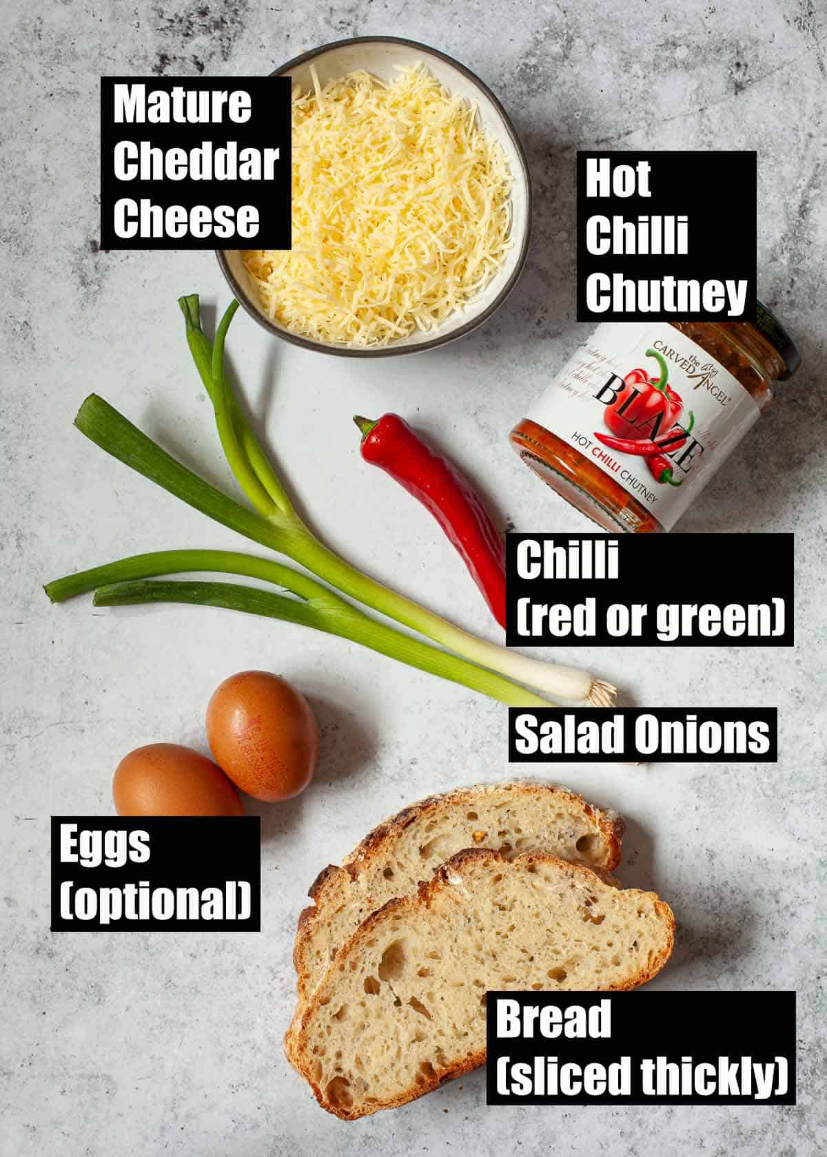 Labelled ingredients for chilli cheese on toast with fried egg.