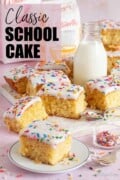 Labelled image of chunks of school cake with a small bottle of milk (iced sponge cake).
