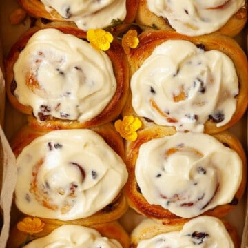 Close up of lemon curd rolls with lemon cream cheese frosting.